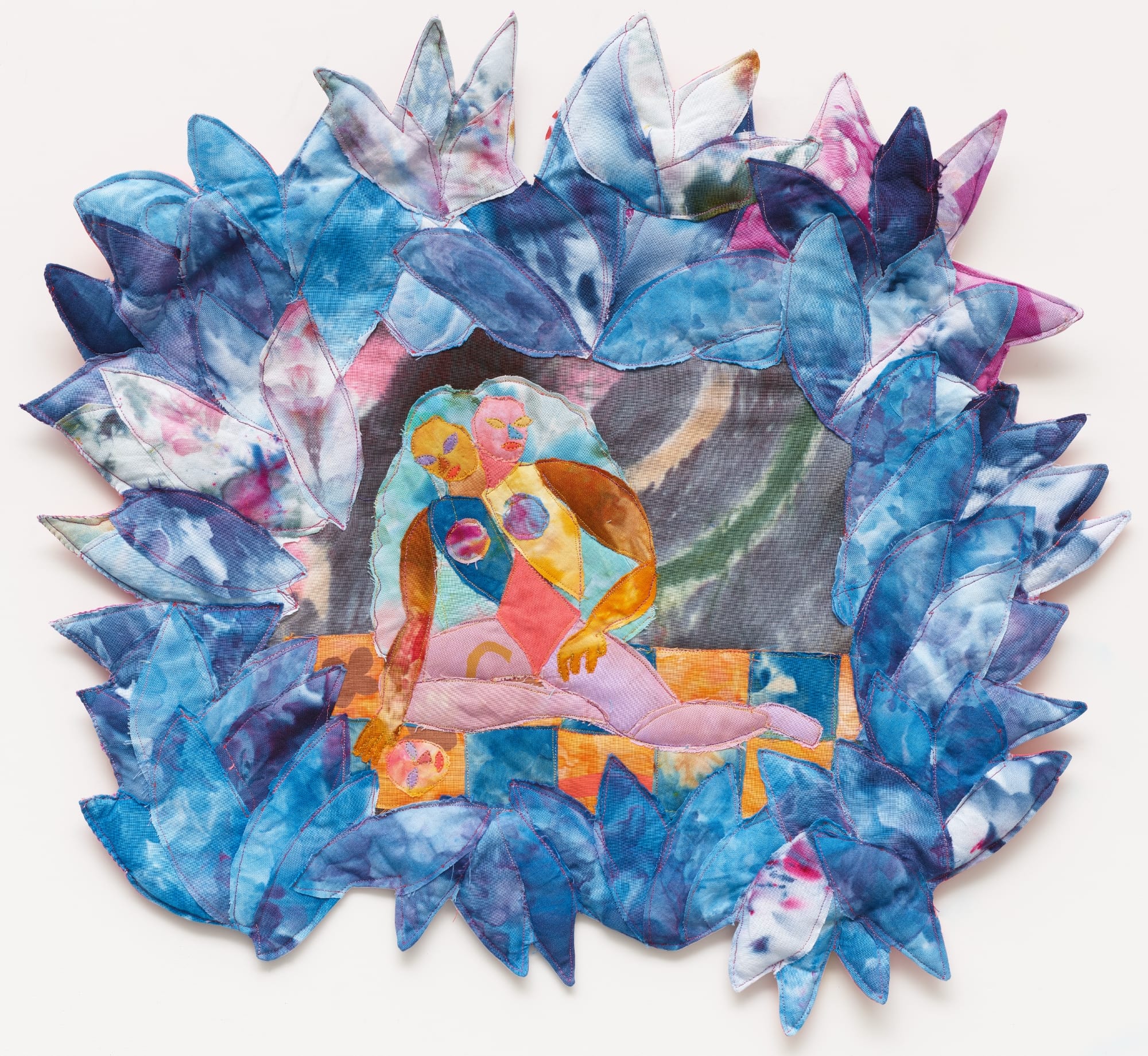 a textile portrait of abstract figures framed by blue leaves