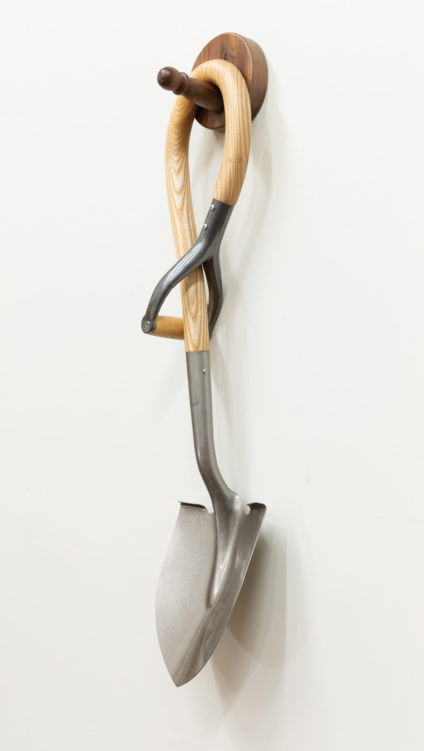 a shovel sculpture with a looped handle by Raul De Lara